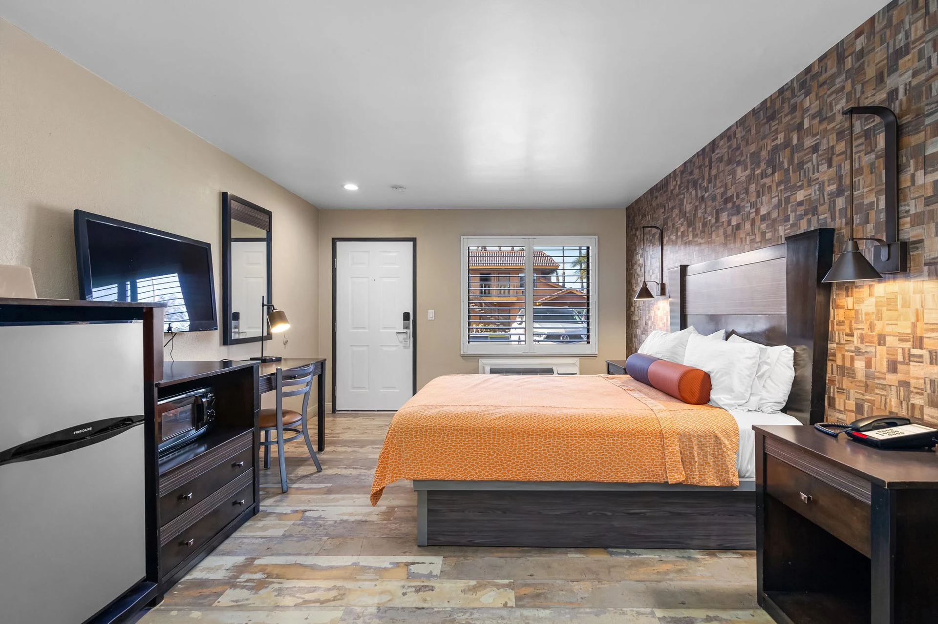 One Queen Bed Room with clean setup and TV area